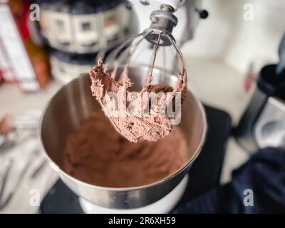 Close-up view of chocolate hazelnut mousse mixed in a stand mixer Stock Photo