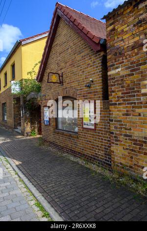 PRODUCTION - 25 May 2023, Saxony-Anhalt, Mühlbeck: The 'Bücher con sum' and the coffee set' in the book village. Literature fans, book addicts and bookworms are drawn to Germany's first book village - but the antiquarian booksellers have no successors in sight 26 years after its founding. (to dpa-Korr 'The magic between the covers of a book - book village seeks successor') Photo: Klaus-Dietmar Gabbert/dpa Stock Photo