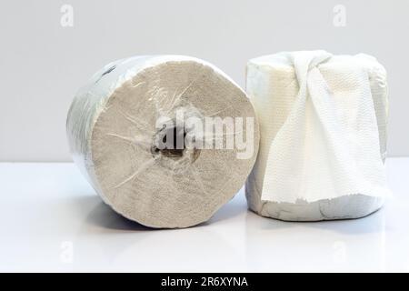 Paper towel rolls on white table in kitchen Stock Photo