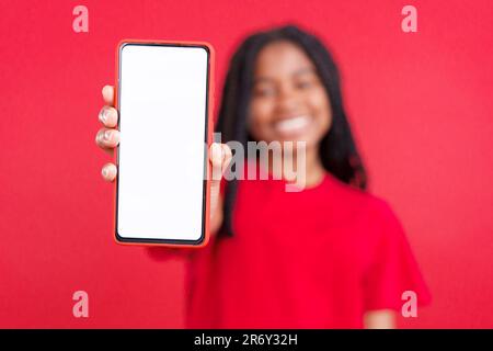Blank screen of the mobile in hands of african woman Stock Photo