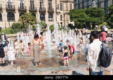 Sheffield, England, UK 10th June, 2023. UK Weather Heatwave Children play in the fountains of Sheffield's Peace Gardens. Credit Washington Imaging. Stock Photo