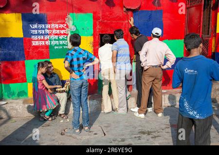 New Delhi, India - November 11, 2011:  wall with political message at Chandini Chowk market. the message means:  when religion gets infected the polit Stock Photo