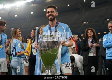 Istanbul, Turkey. 10th June, 2023. Bernardo Silva of Manchester City celebrates while holding a trophy after the UEFA Champions League final match between Manchester City and Inter at Ataturk Olympic Stadium. Final score; Manchester City 1:0 Inter. Credit: SOPA Images Limited/Alamy Live News Stock Photo