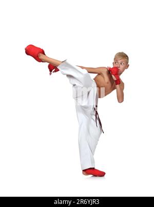 young boy in white kimono training karate Stock Photo