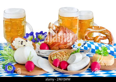 Bavarian food and drink with beer, sausages and knuckle of pork for October Festival isolated on white background Stock Photo