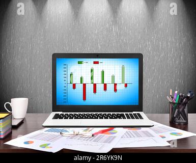 notebook with cost chart on screen, business concept Stock Photo