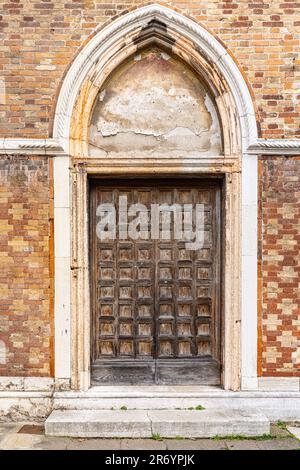Big old wooden door. Old medieval door Stock Photo