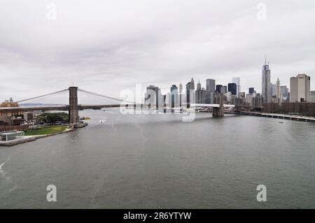 A view of the East River, The Brooklyn bridge and Manhattan seen from the Manhattan bridge in New York CIty, USA. Stock Photo