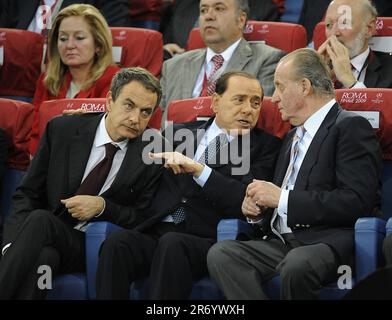 File photo dated 27/05/09 of former Italian Prime Minister Silvio Berlusconi who died on Monday aged 86, shown here talking to Spain's (now former) Prime Minister Jose Luis Rodriguez Zapatero (left) and (now former)King Juan Carlos (right) of Spain at UEFA Champions League Final between Barcelona and Manchester United at Stadio Olimpico in Rome, Italy. Stock Photo