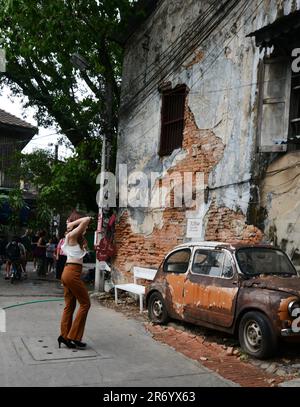 Walking through the historical neighborhood of Talat Noi in Bangkok, Thailand. Stock Photo