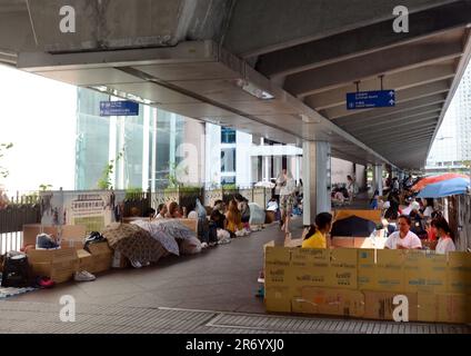 Filipino domestic helpers enjoying their Sunday ( day off ) in Hong Kong Central district. Stock Photo