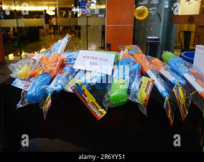 Water guns soldduring the   Songkran ( Thai New Year ) on Khaosan Road, Banglamphu, Bangkok, Thailand. Stock Photo