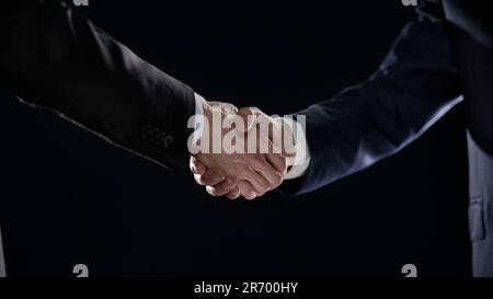 Close-up image of handshake between two colleagues. Stock Photo