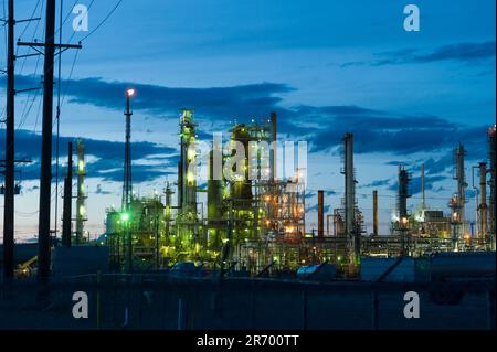 The lights of the Sinclair oil refinery glow near Casper, Wyoming. Stock Photo