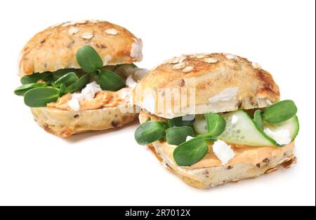 Delicious sandwiches with hummus, microgreens and cucumber slices isolated on white Stock Photo