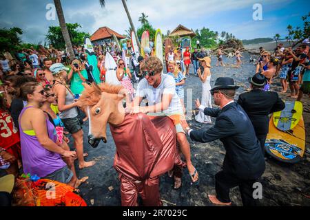 Surf in a carnival costumes, Bali, Indonesia. Stock Photo