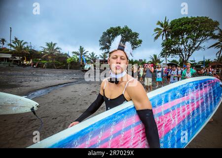 Surf in a carnival costumes, Bali, Indonesia. Stock Photo