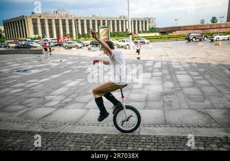 Teenager Riding Unicycles At The Street Of Saint Petersburg, Russia Stock Photo