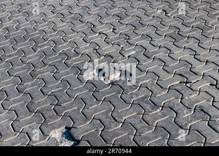 Concrete tile which paved part of the road for traffic, part of the road made of concrete tiles Stock Photo