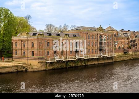 Bonding Warehouse on the bank of the River Ouse is now a luxury apartment. York, North Yorkshire. UK Stock Photo
