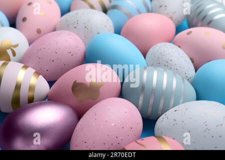 Many painted Easter eggs as background, closeup Stock Photo