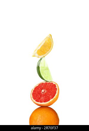 Stack of different fresh citrus fruits on white background Stock Photo