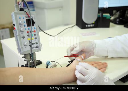 Electroneuromyography. A new direction in medicine is electroneuromyography. Neuromyography. Stock Photo