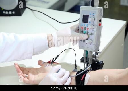 Electroneuromyography. A new direction in medicine is electroneuromyography. Neuromyography. Stock Photo