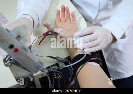 Electroneuromyography. A new direction in medicine is electroneuromyography. Neuromyography. Stock Photo