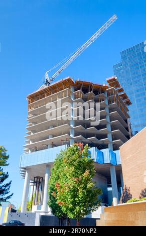 Concrete building under constraction on blue sky background Stock Photo