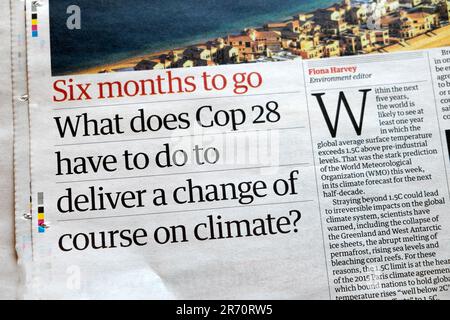 'What does Cop28 have to do to deliver a change of course on climate?' Guardian newspaper headline climate crisis article 3 June 2023 London UK Stock Photo