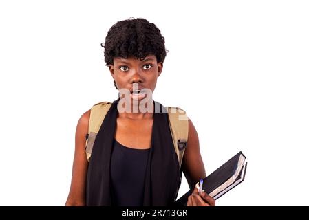 astonished student girl looking at something while opening her mouth. Stock Photo