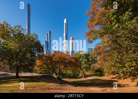 Central Park in Fall with view of supertall skyscrapers of Billionaires' Row. Midtown Manhattan, New York City Stock Photo