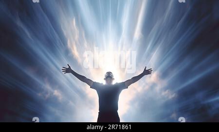 Man with arms to the sky illuminated by a beam of heavenly light Stock Photo
