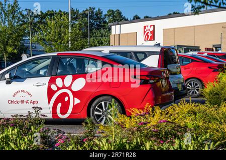 Chick-fil-A delivery vehicles at Chick-fil-A in Stone Mountain, Georgia. (USA) Stock Photo