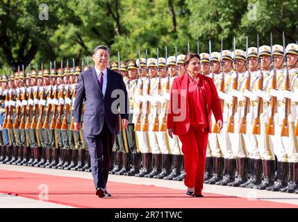 Beijing, China. 12th June, 2023. Chinese President Xi Jinping holds a welcoming ceremony for President of the Republic of Honduras Iris Xiomara Castro Sarmiento at the square outside the east entrance of the Great Hall of the People prior to their talks in Beijing, capital of China, June 12, 2023. Xi held talks with Castro, who is on a state visit to China, in Beijing on Monday. Credit: Liu Bin/Xinhua/Alamy Live News Stock Photo