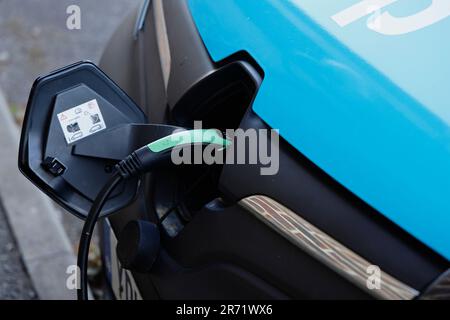 Transport, Road, Car, Renault supermarket electric delivery van being charged, Cranbrook, Kent, England. Stock Photo