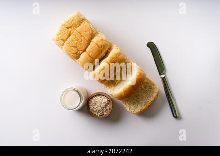 Fresh Baked brioche soft and fluffy bun white Bread or milk bread. isolated white background Stock Photo