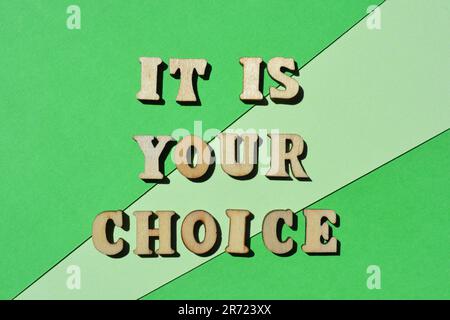 It Is Your Choice, words in wooden alphabet letters isolated on green background Stock Photo