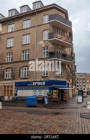 Copenhagen, Denmark - September 14, 2010: Irma grocery store on corner of Andreas Bioras Gade in residential Christianshavn neighborhood. Merchandise Stock Photo