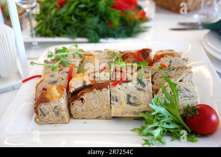 Exquisite Stuffed Chicken Presentation on Banquet Table, Bokeh Background Stock Photo