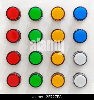 Group of multicolored buttons on a white control panel Stock Photo