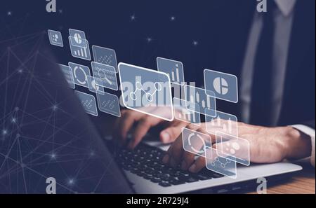 Big data analytics and business intelligence concept with chart and graph icons on a digital screen interface. businessman use laptop. Stock Photo