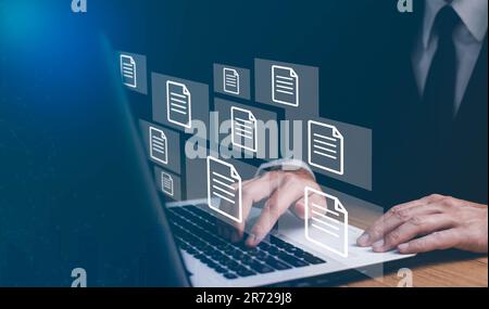 Businesswoman working on laptop with virtual screen. Process automation to efficiently manage files. Online documentation database and document manage Stock Photo