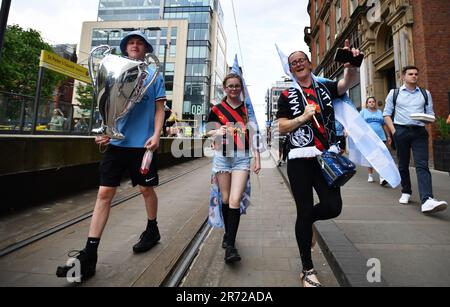 Manchester, UK. 12th June, 2023. Manchester, UK. 12th June, 2023. Fans arriving for the Treble winning Victory Parade ending at the Town Hall, Manchester. Picture credit should read: Gary Oakley/Sportimage Credit: Sportimage Ltd/Alamy Live News Stock Photo