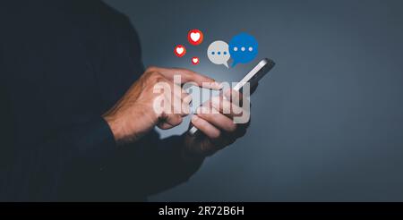 Social media and digital online concept, man using smart phone. The concept of living on vacation and playing social media. Social Distancing. Stock Photo