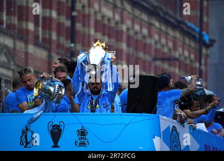 Manchester City's Bernardo Silva lifts the Premeir League trophy during the Treble Parade in Manchester. Manchester City completed the treble (Champions League, Premier League and FA Cup) after a 1-0 victory over Inter Milan in Istanbul secured them Champions League glory. Picture date: Monday June 12, 2023. Stock Photo