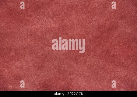 Texture of dark red suede, matte background. Fabric, leather, material for accessories manufacturing Stock Photo