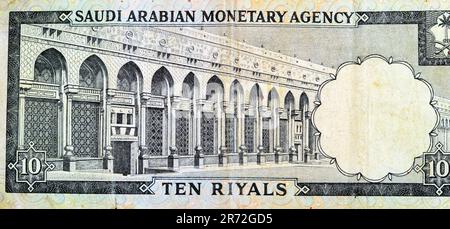 Large fragment of the reverse side of 10 SAR Saudi Arabia riyals cash money currency banknote features Al-Masa Wall with arch at Al-Masjid al-Haram (H Stock Photo