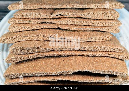 Brown baked pitta bread flatbread made mainly in bran, Bran breads used for sandwiches and beside meals, popular in Egypt, brown circular and round ba Stock Photo